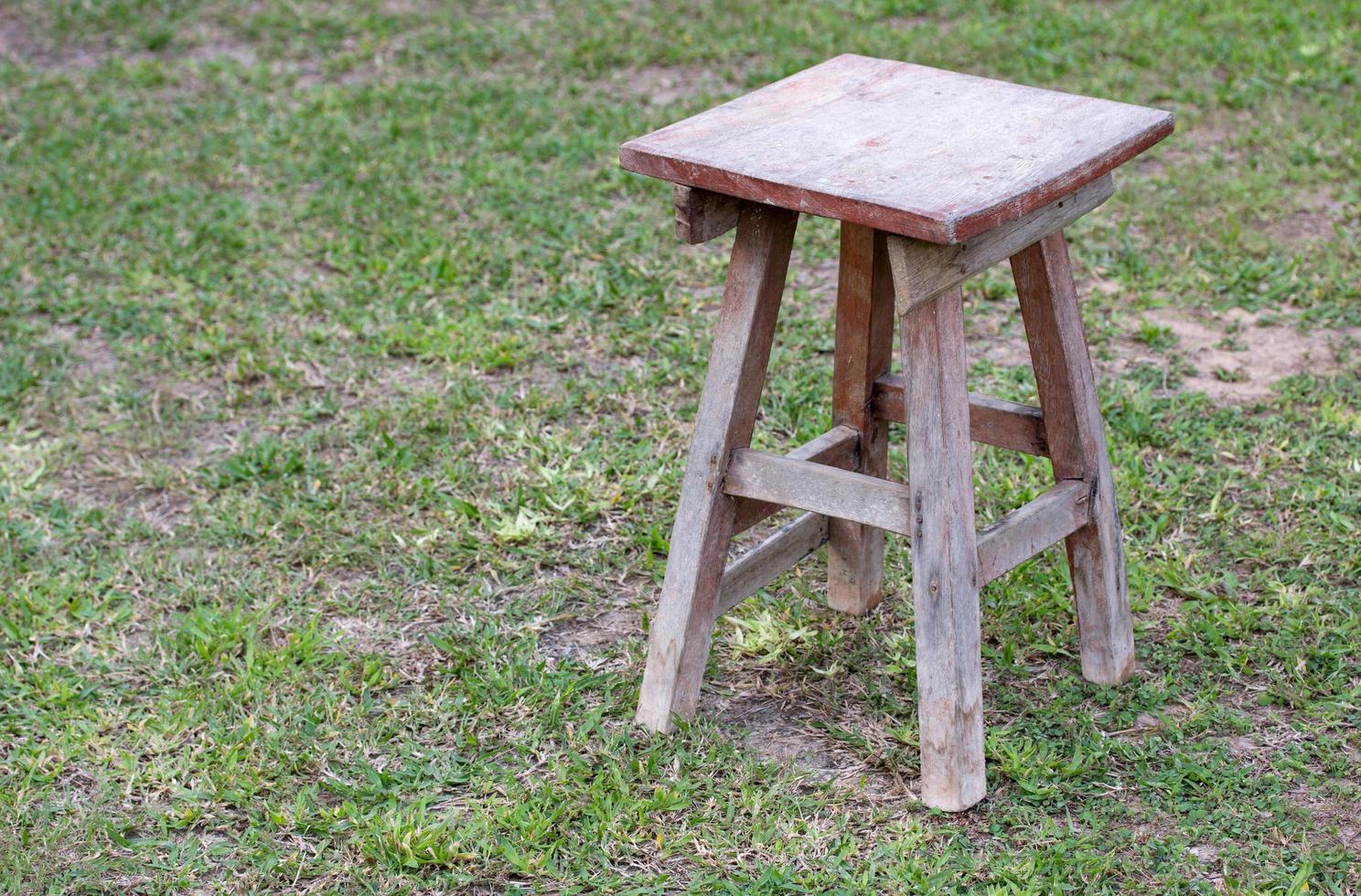 old wooden chair in the grass field outdoor photo