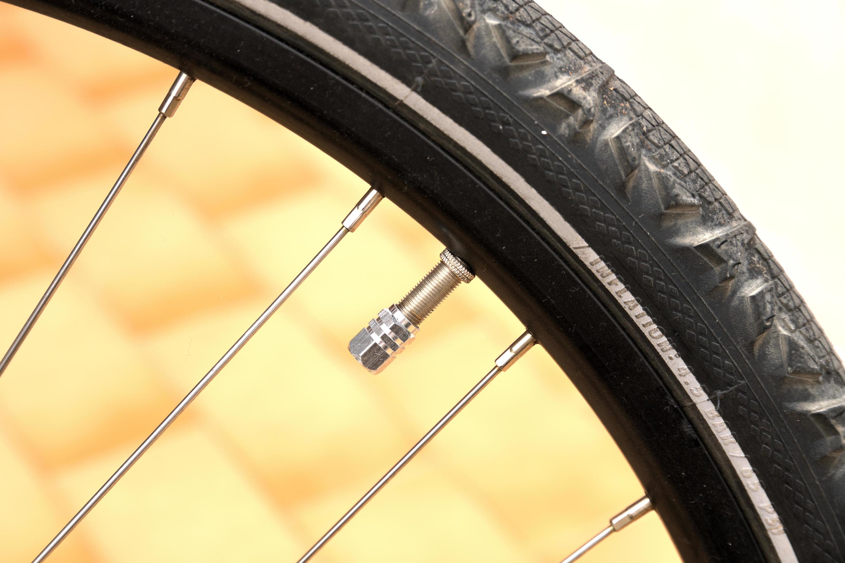 Close up of valve on bicycle tire 17600609 Stock Photo at Vecteezy