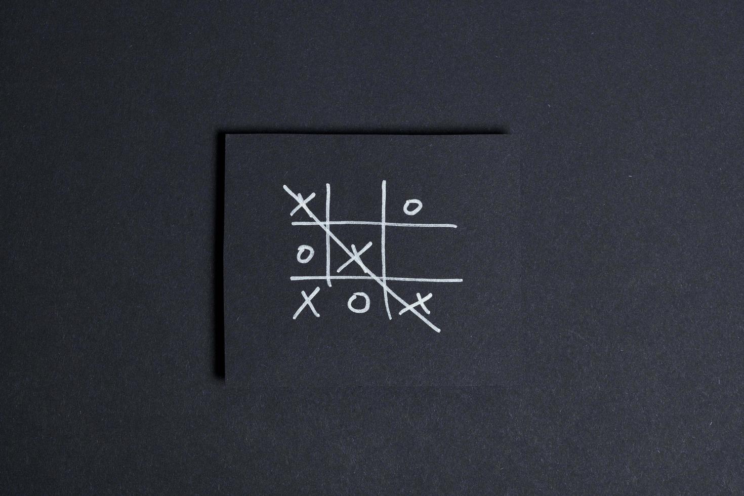 Tic tac toe isolated on black background photo