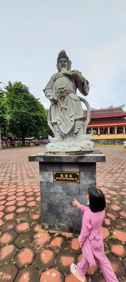 Semarang, Central Java on November 2021. A girl walking in the Sam Poo Kong Temple Area Semarang. photo