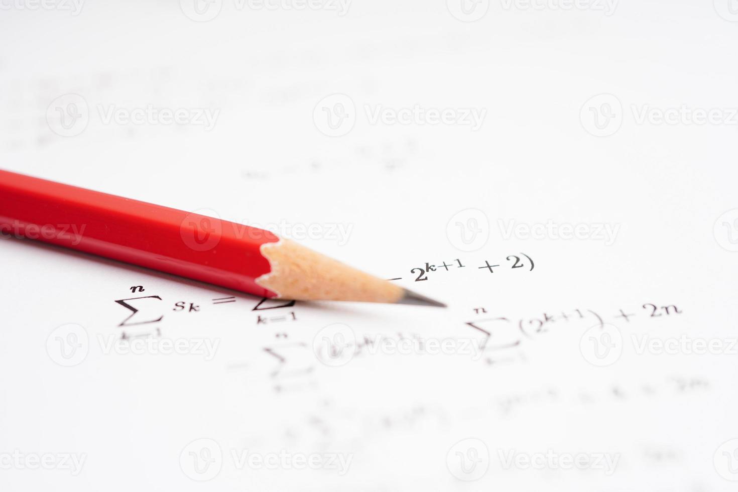 Pencil on mathematic formula exercise test paper in education school. photo