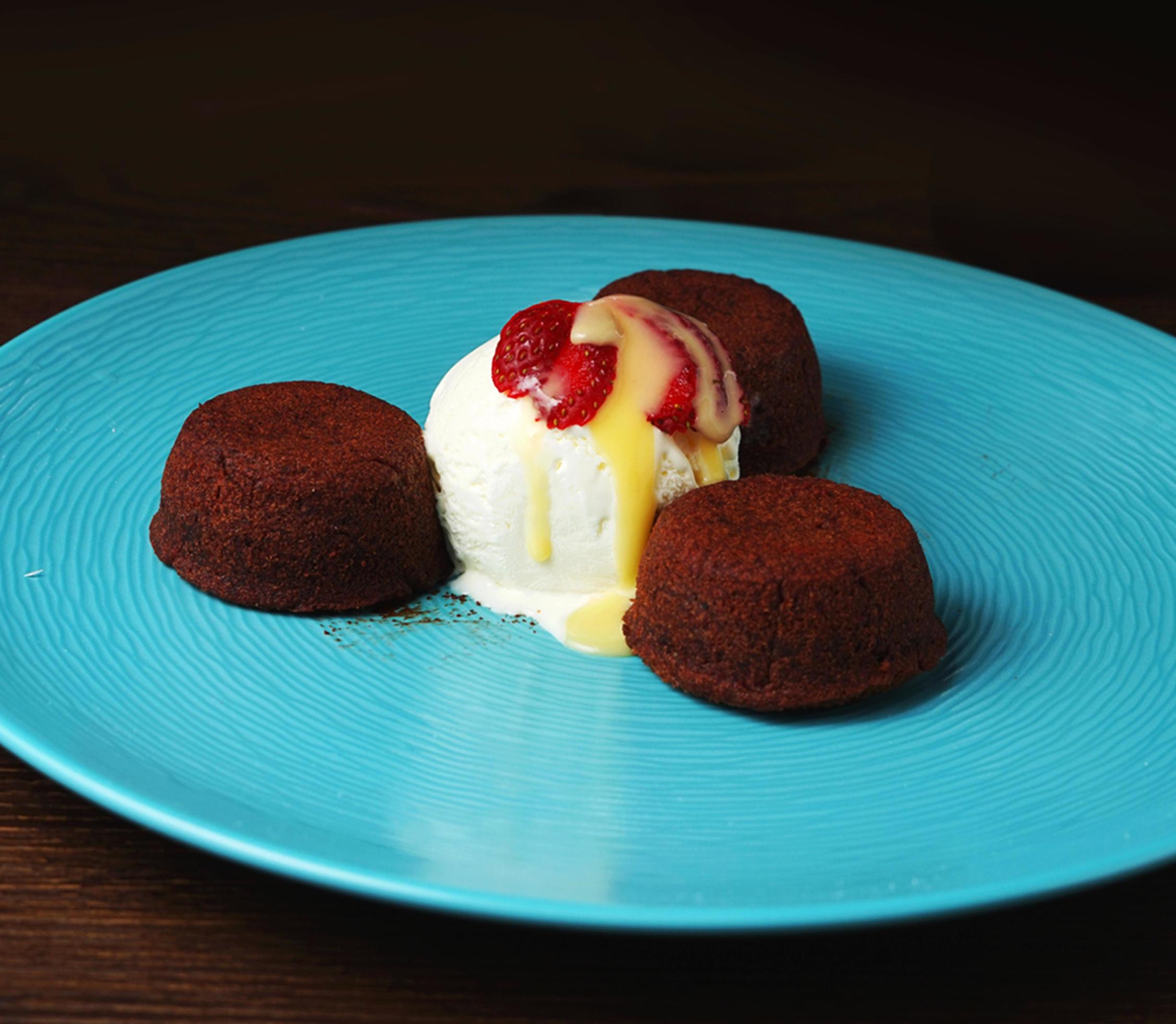 Delicious chocolate cake and ice cream. Chocolate fudge cake and ice