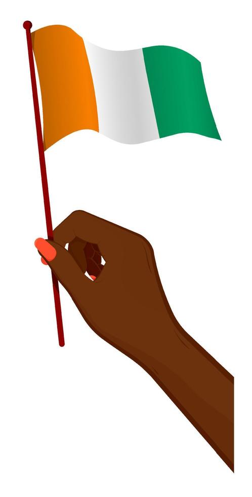 la mano femenina sostiene suavemente la pequeña bandera de Costa de Marfil. elemento de diseño de vacaciones. vector de dibujos animados sobre fondo blanco
