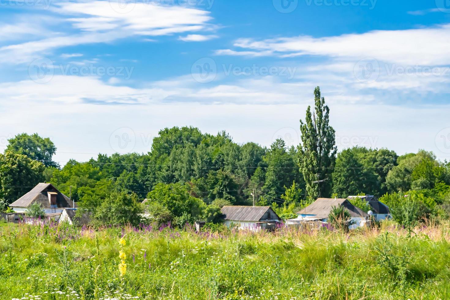 Beautiful old abandoned building farm house in countryside on natural background photo