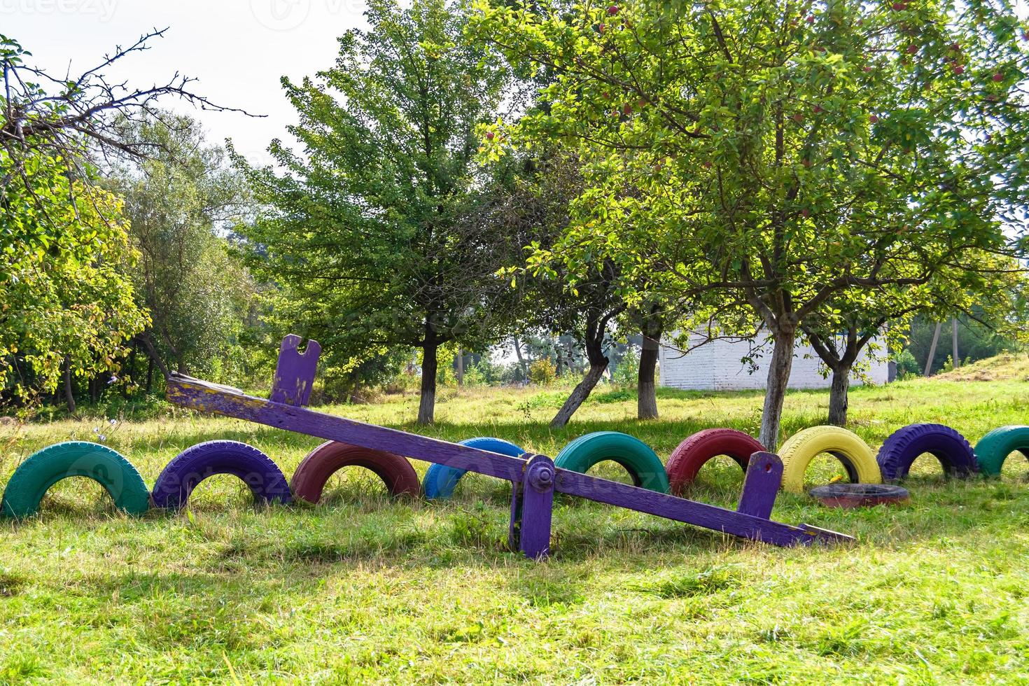 Photography on theme empty playground with metal swing for kids photo