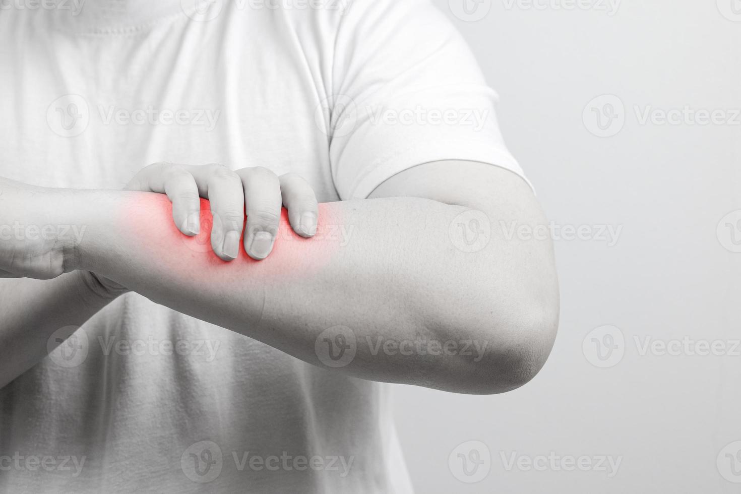 Muscle pain, arm pain, burning sensation, weak muscles, Office syndrome, Muscle tear caused by exercise, red inflamed zone. man having arm pain on a gray background. concept of healthcare photo