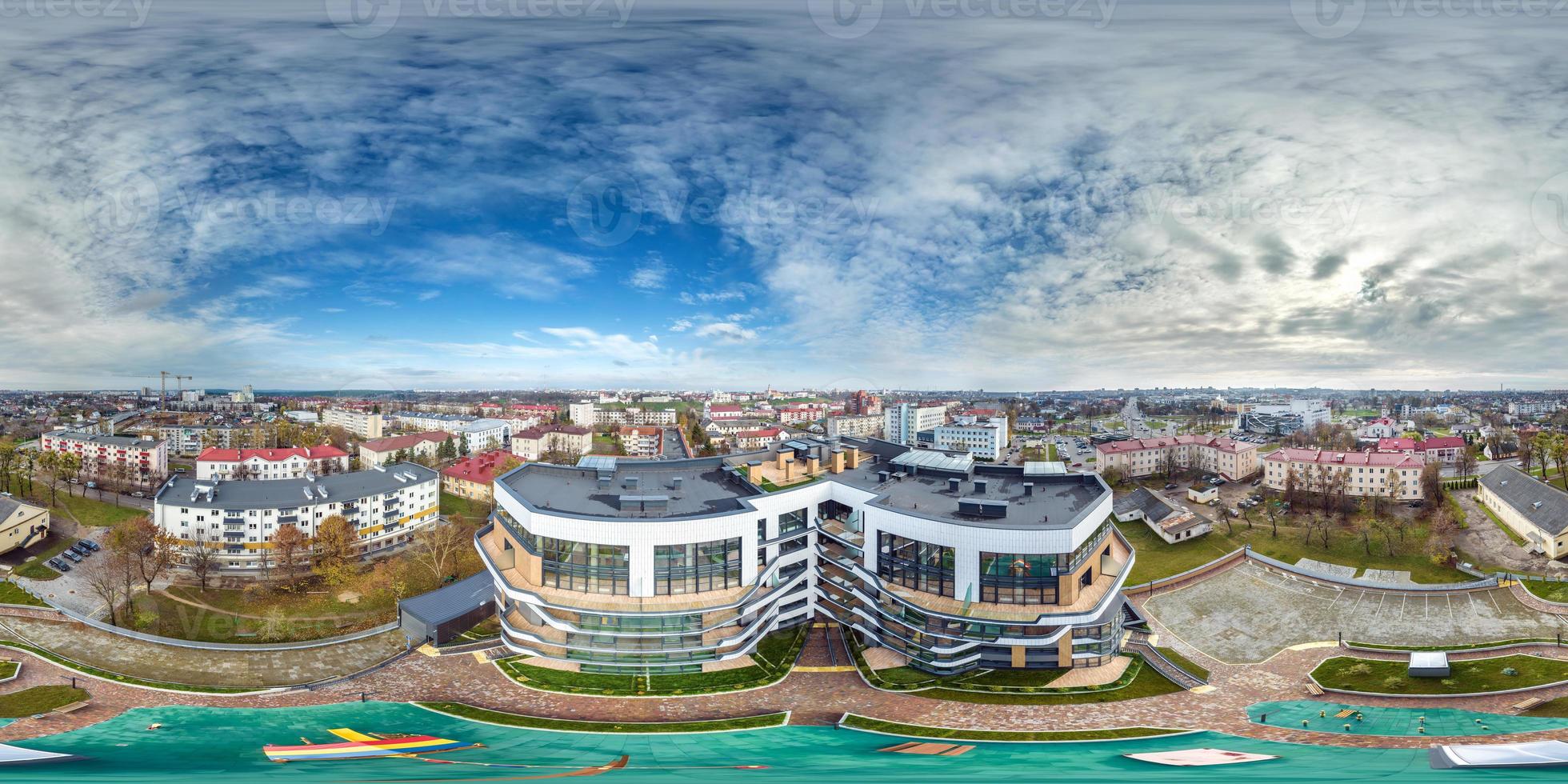 aerial full seamless spherical 360 hdri panorama view in city overlooking of residential area of high-rise buildings in equirectangular projection. photo