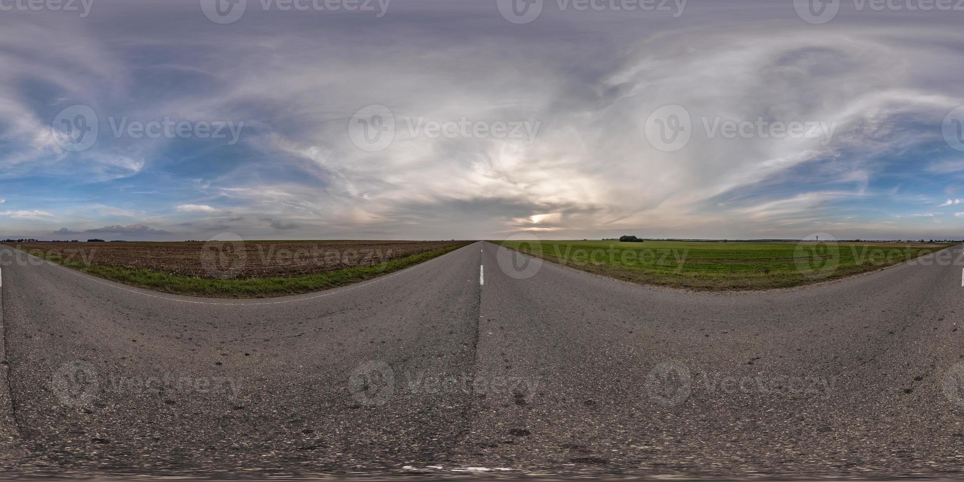 full seamless spherical hdri 360 panorama view on no traffic asphault road among fields with evening sky and clouds in equirectangular projection,can be used as replacement for sky in panoramas photo