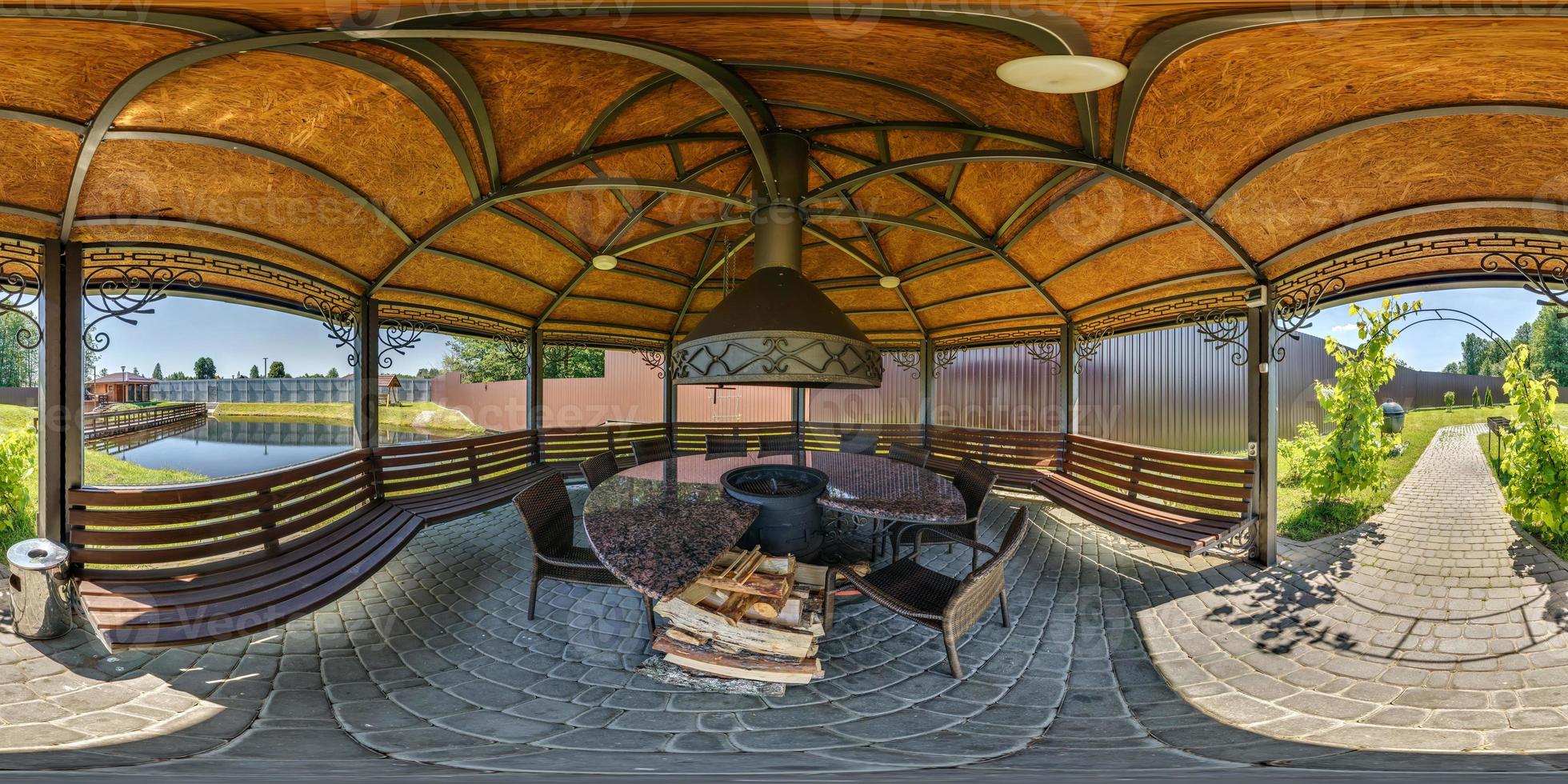 360 seamless hdri panorama view inside gazebo near river or lake with fireplace, table and chairs in equirectangular spherical projection, ready AR VR virtual reality content photo