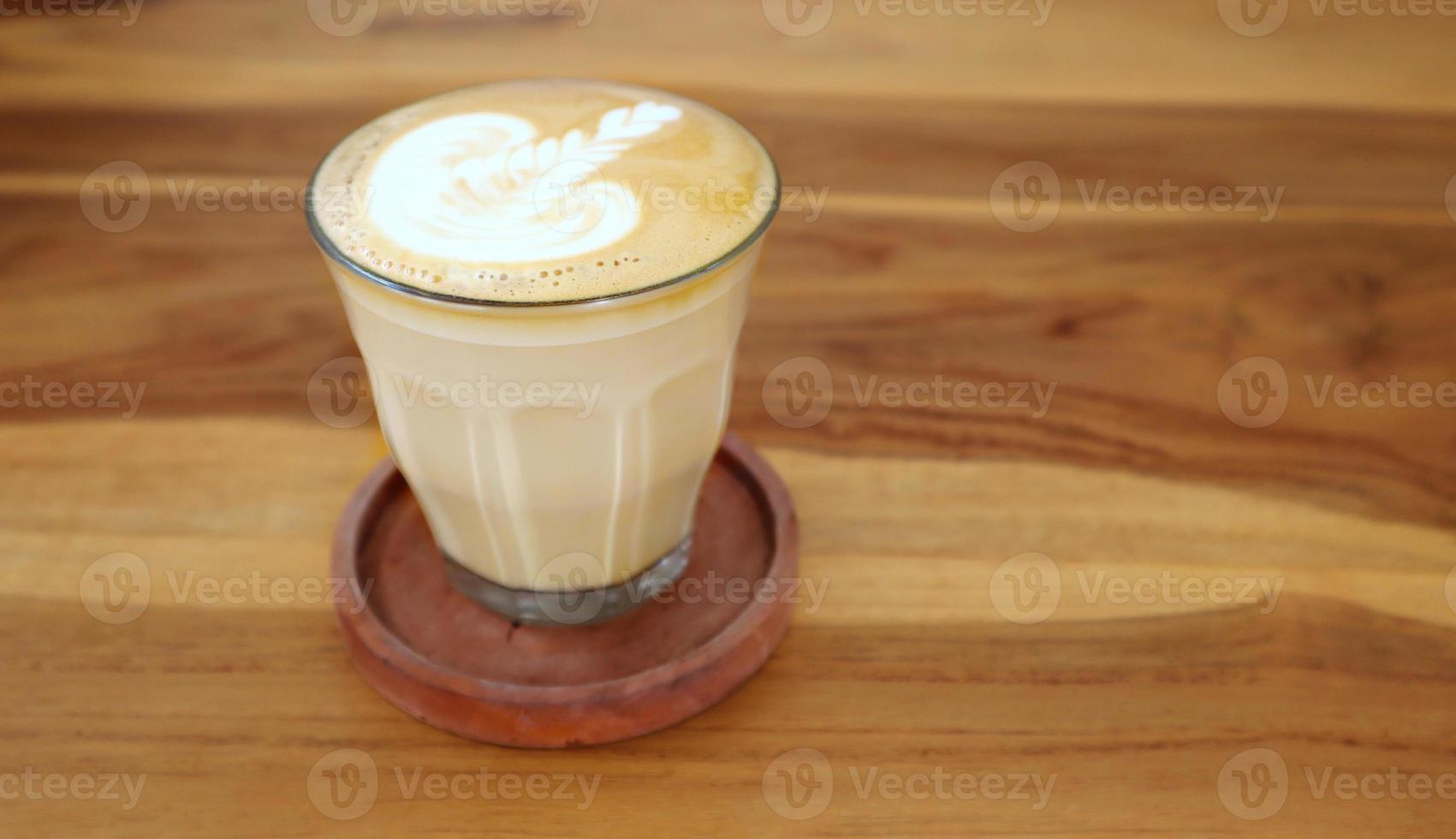 Coffee cafe latte with carved foam foam photo