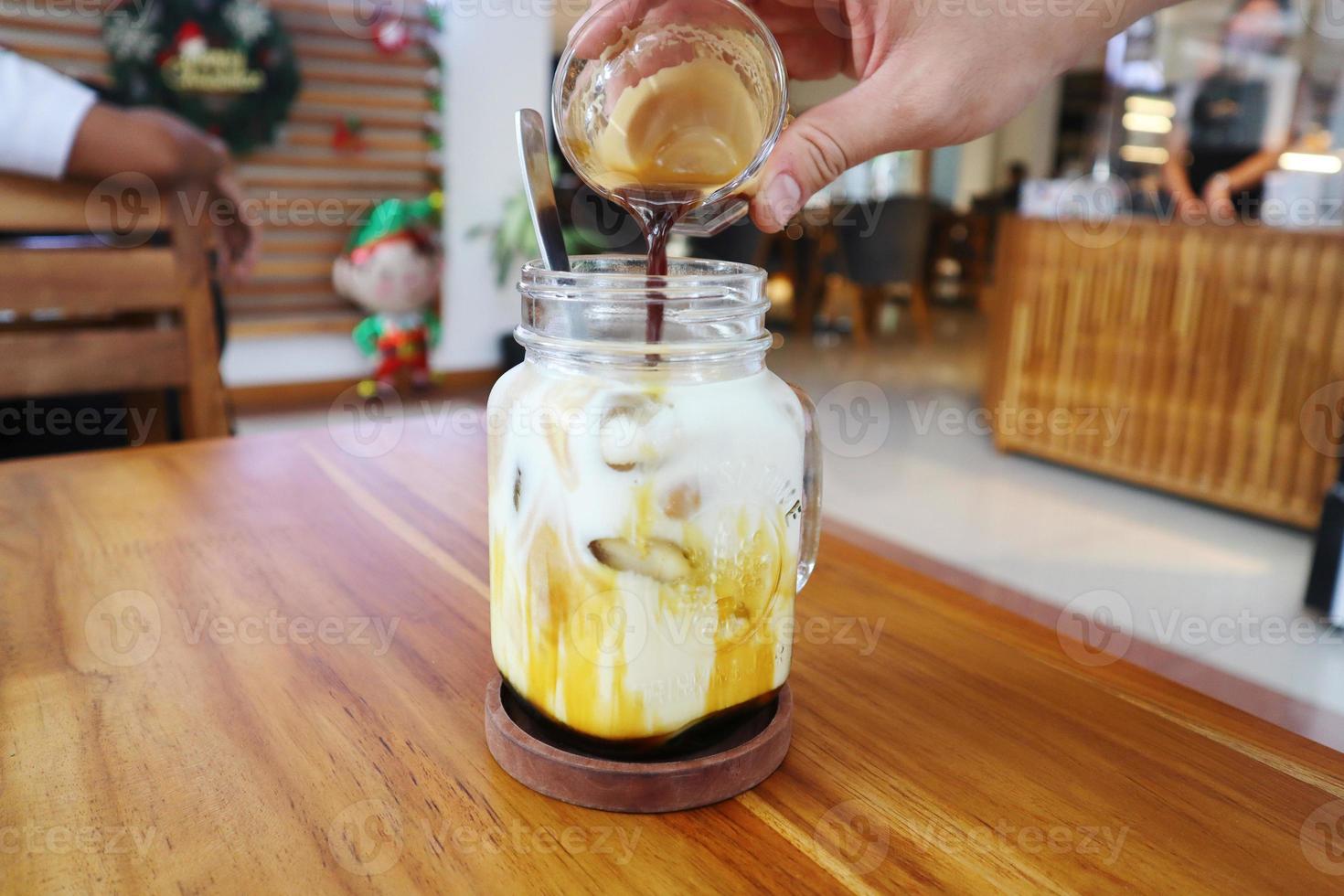 A glass of palm sugar iced milk photo
