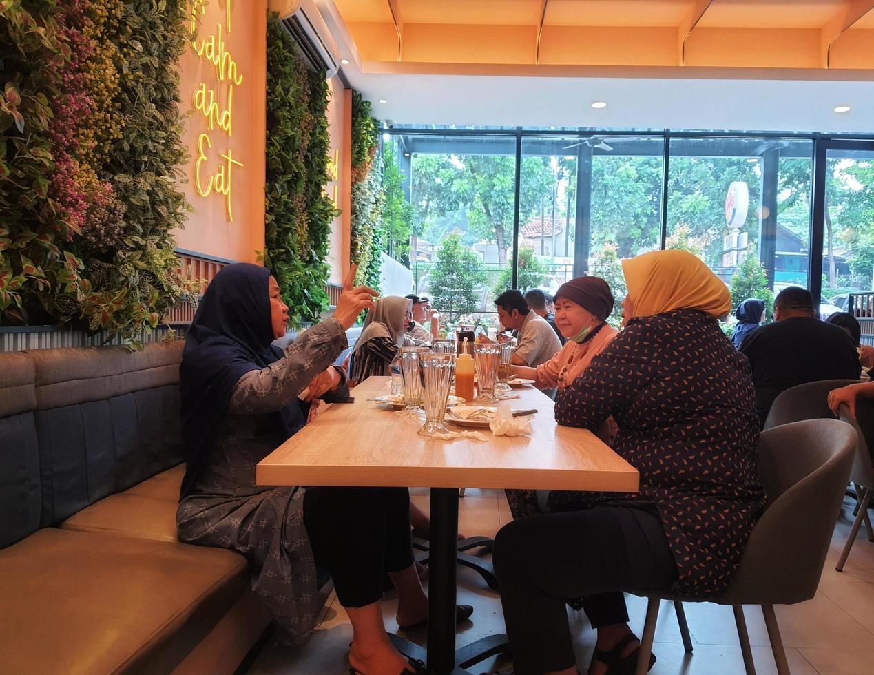 Jakarta, Indonesia in July 2022. The atmosphere of the Solaria restaurant where many visitors are families eating together. photo