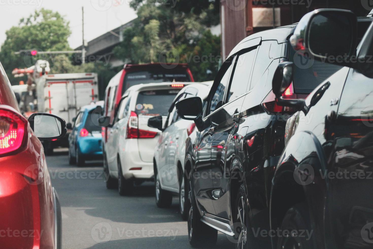 Close up photo of a back lamp of car that stuck in a traffic jam on the highway,