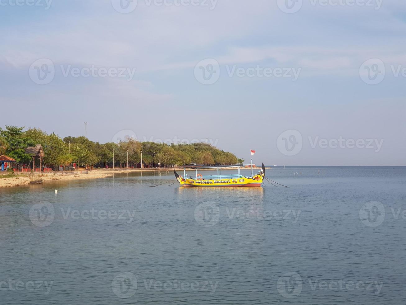 A pier for anchor ships and small boats on a beach called Tirta Samudera Beach or Bandengan Beach photo