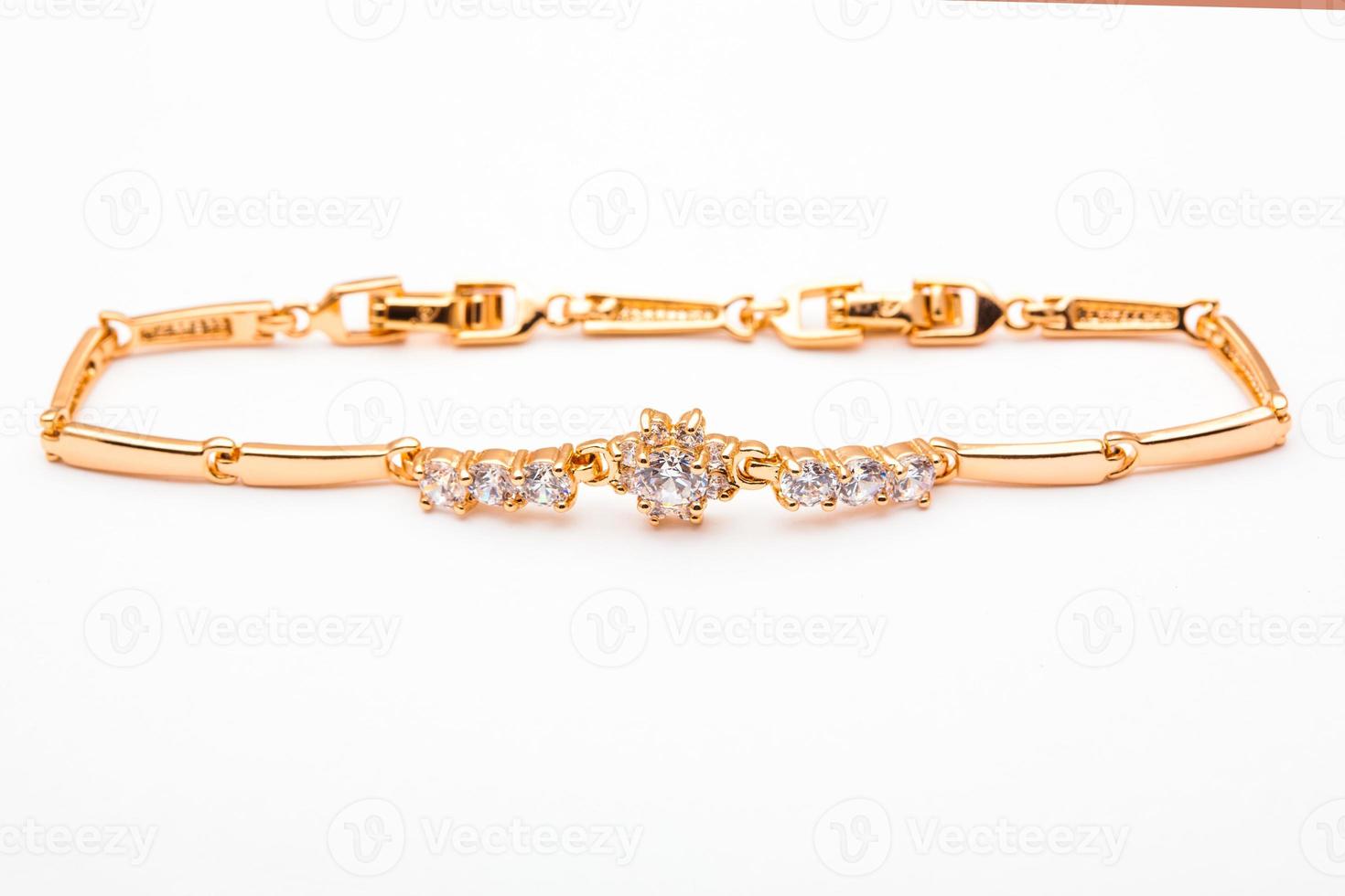 jewelry gold bracelet with precious stones isolated on white background . photo
