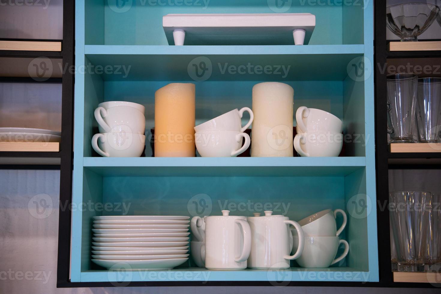 kitchen utensils on the shelf in the closet photo