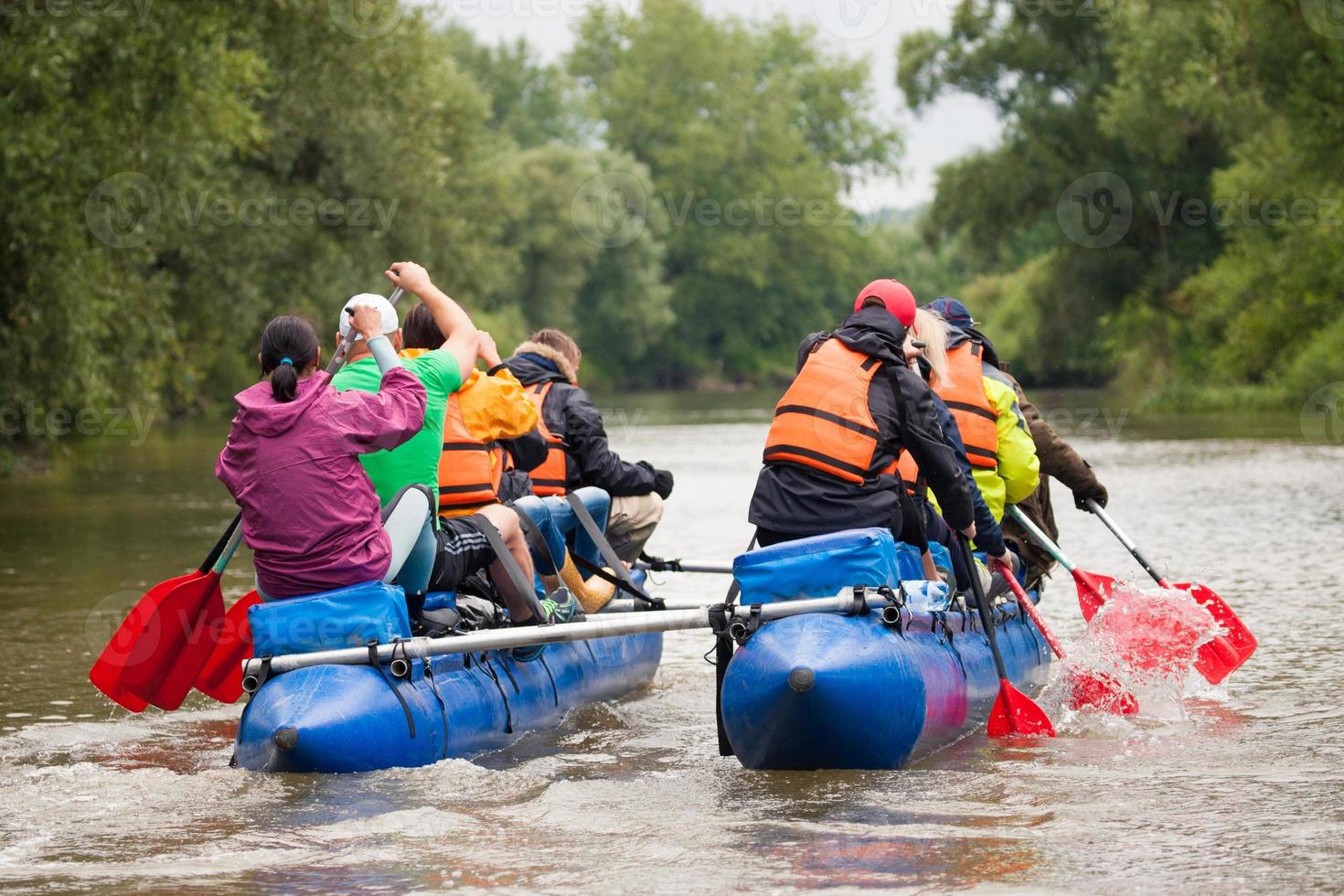 competition of teams on catamarans on the river, rafting photo