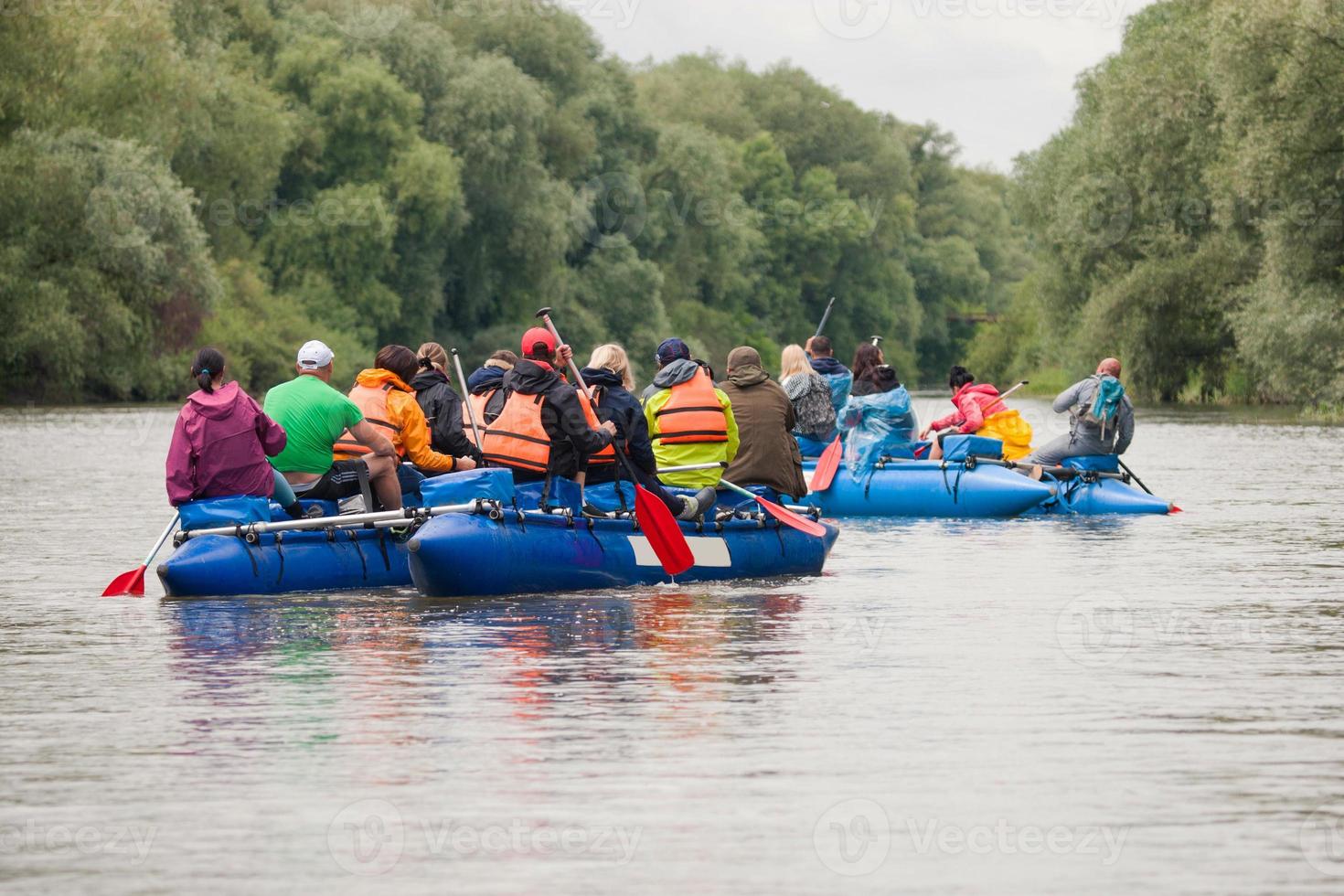 competition of teams on catamarans on the river, rafting photo