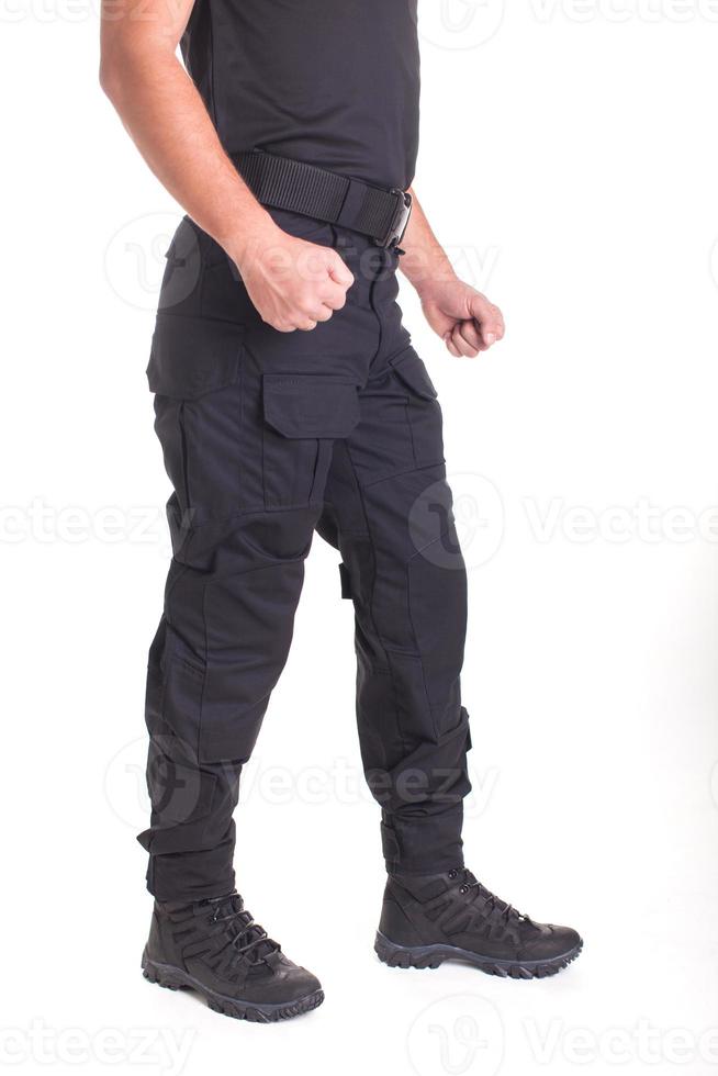 A fighter in military uniform is ready for a fight on a white background photo