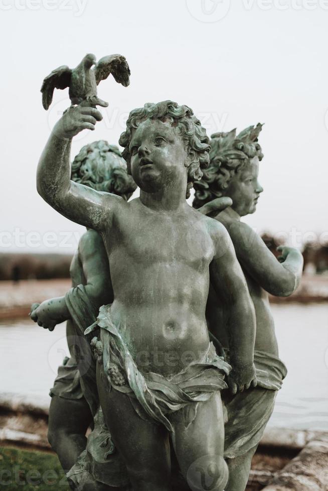 Versailles France sculptures in the courtyard of the castle, facade architecture. photo