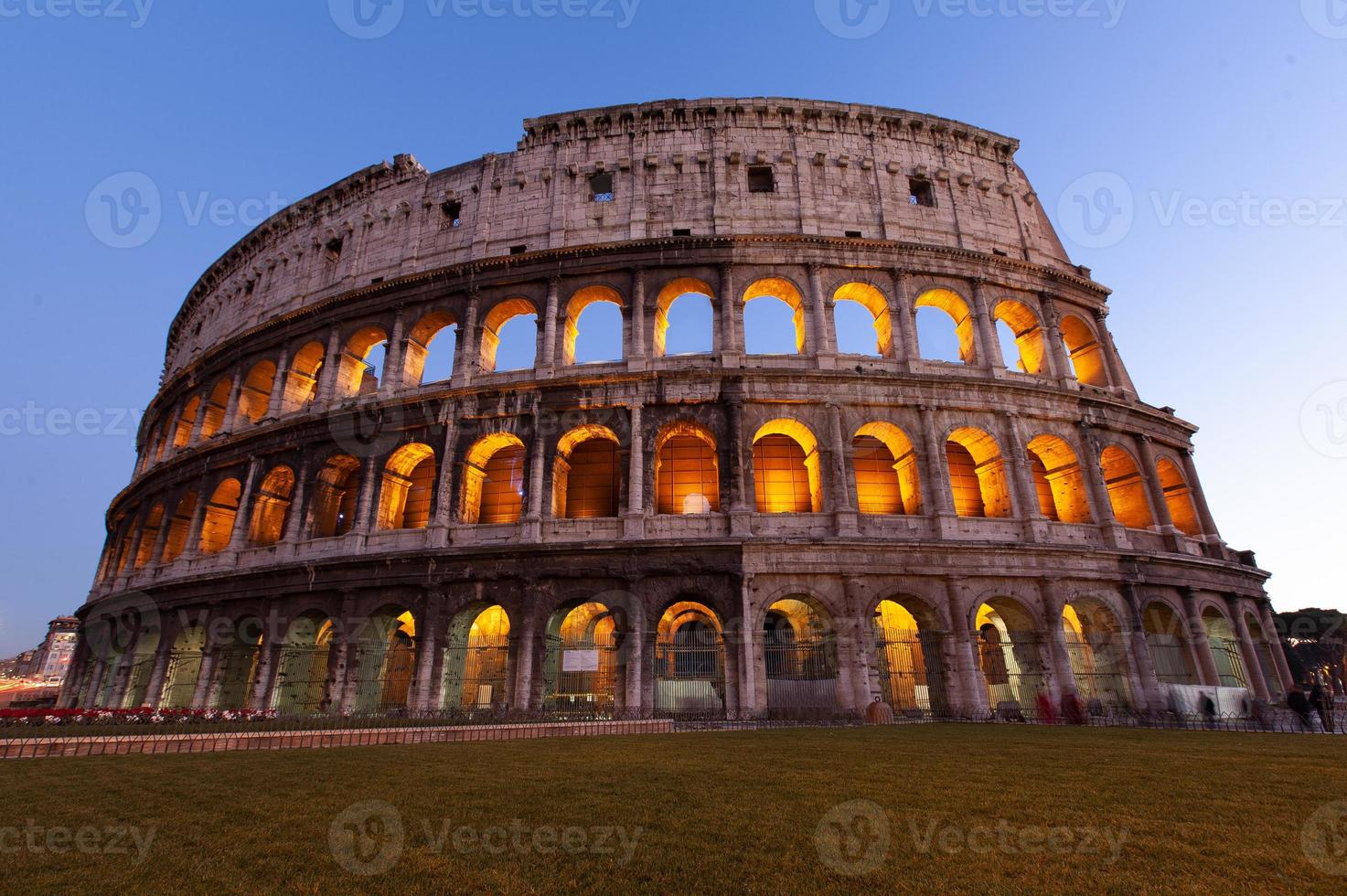 rome, italy, colosseum old ancient building gladiator battle at night. photo