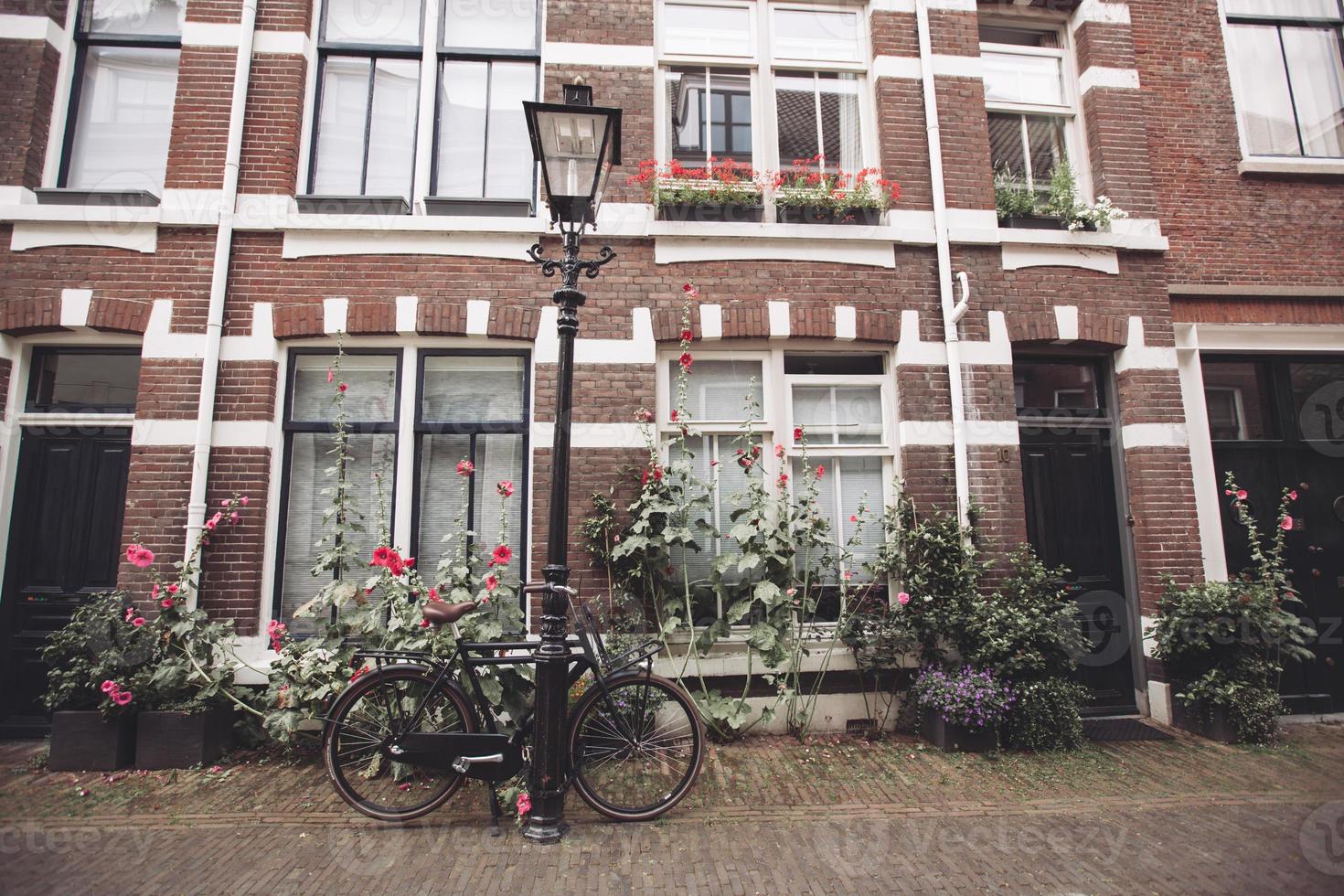 beautiful architecture house facade and bicycle on the streets of the city of Utrecht in the Netherlands. photo