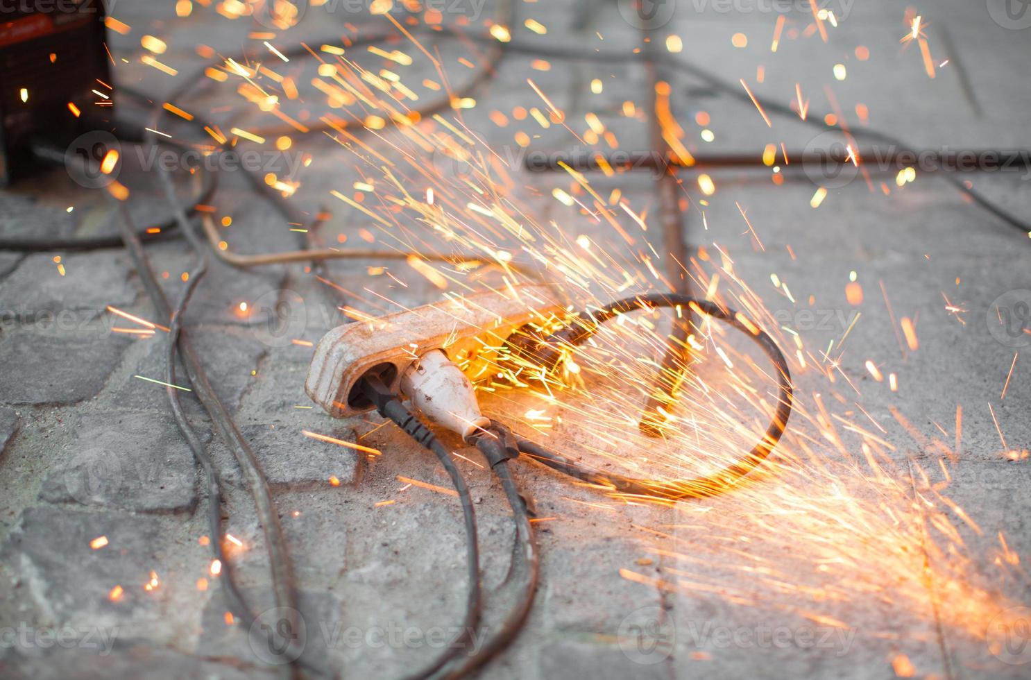 burning spark electrical outlet shorting, danger photo