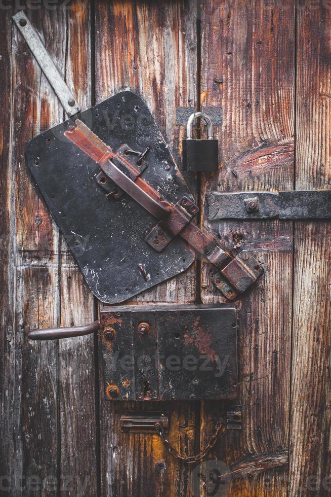 Old door, wood texture, metal latch lock photo