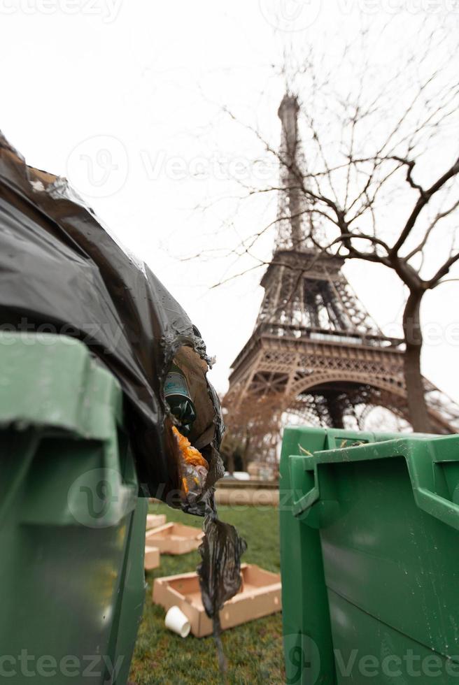 Paris, Eiffel Tower with garbage cans in front. photo