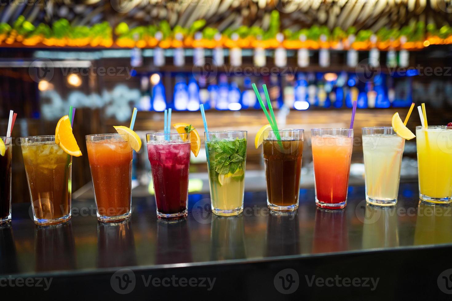 many different cocktails prepared by at the bar photo