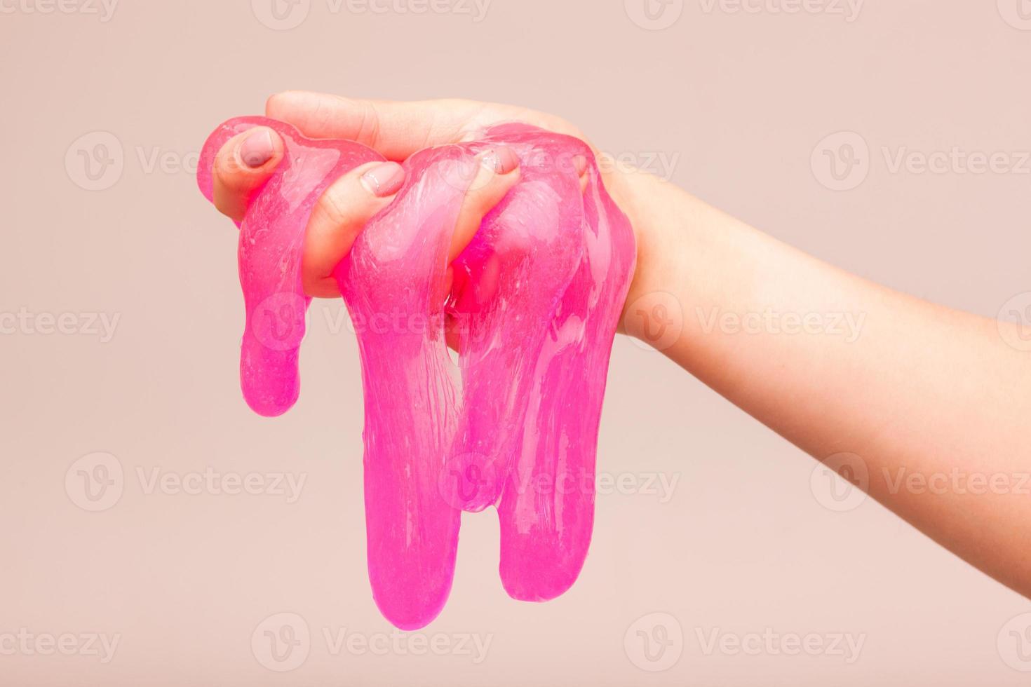 a toy for children mucus and liquid flowing on hand photo