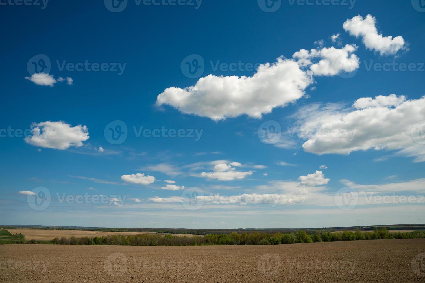 beautiful landscape of blue sky with clouds and field in Ukraine photo