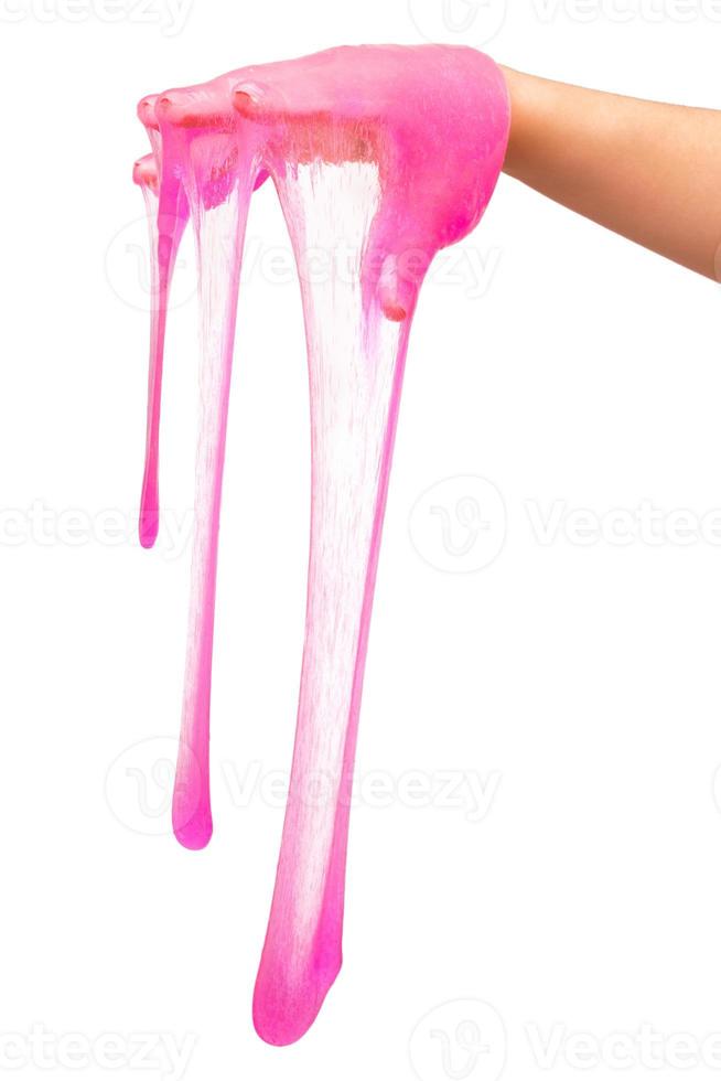 a toy for children mucus and liquid flowing on hand on a white background photo