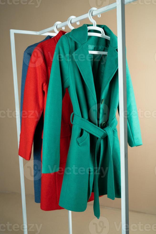 coat of different colors on a hanger photo