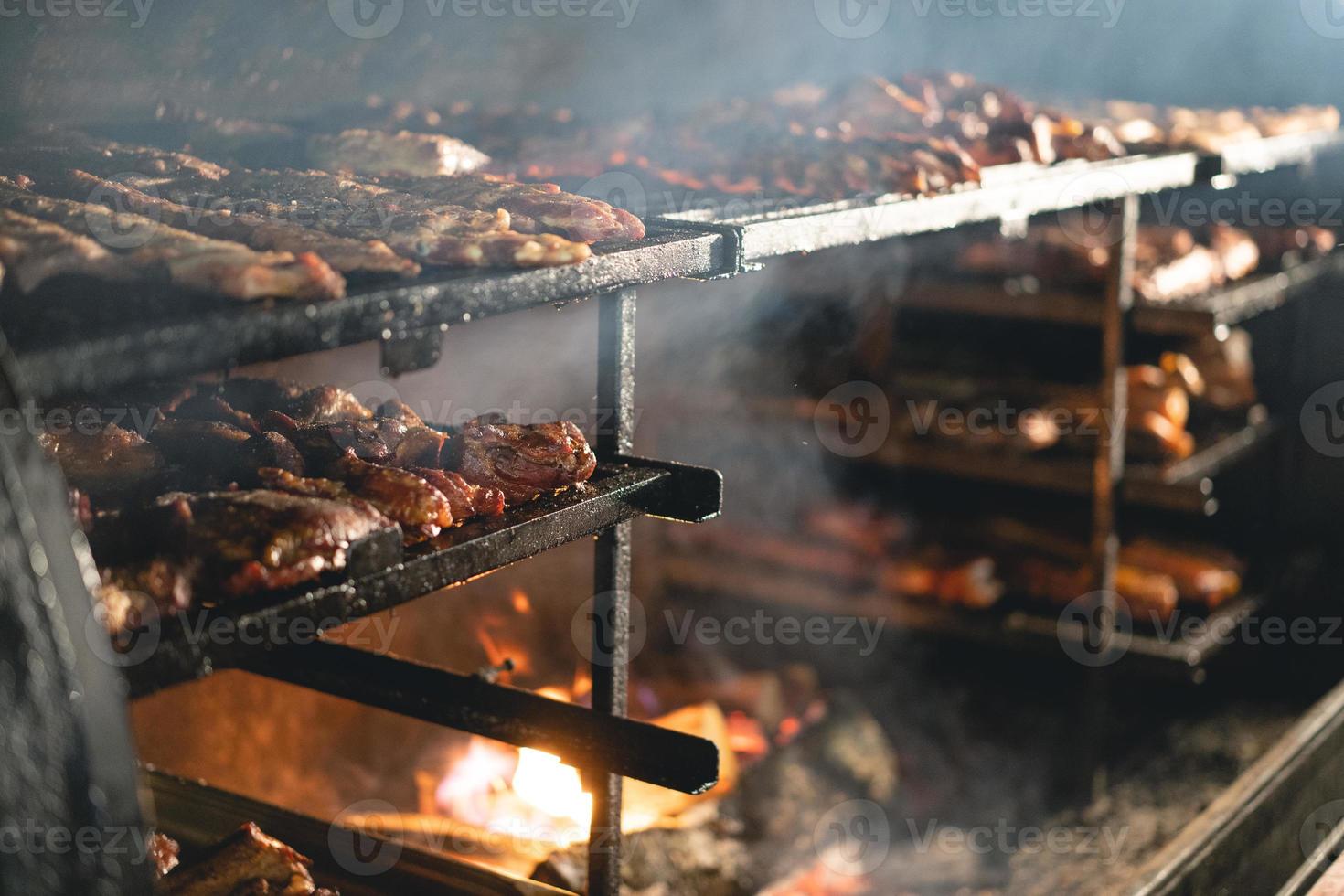 many meat baked on the grill photo