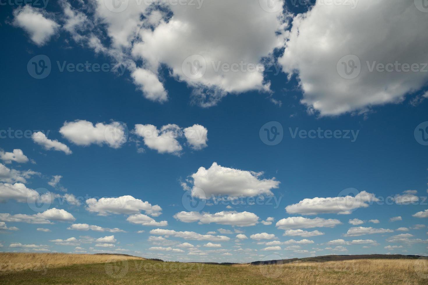 beautiful landscape of blue sky with clouds and field in Ukraine photo