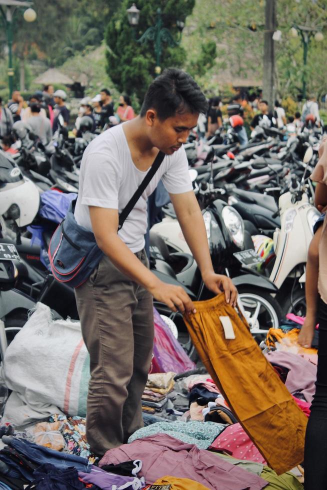 Badung, Bali - January 13 2023 Photo of a seller and a buyer doing a bargain and a transaction between them.