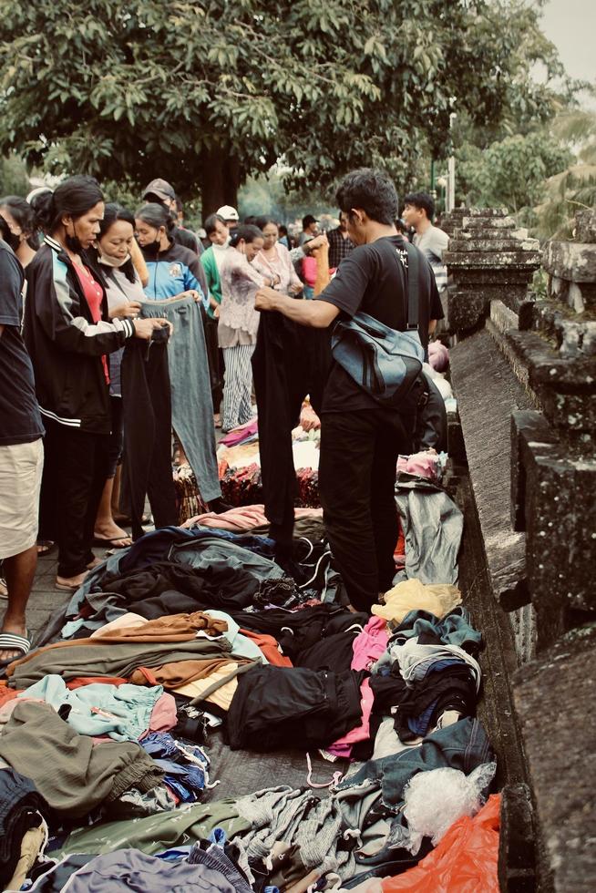 Badung, Bali - January 13 2023 Photo of a seller and a buyer doing a bargain and a transaction between them.