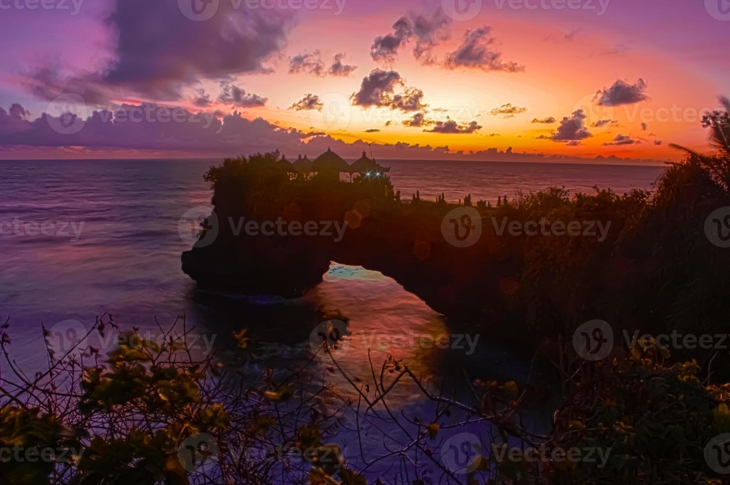 A beauty of sunset on Tanah Lot Temple in Bali. photo