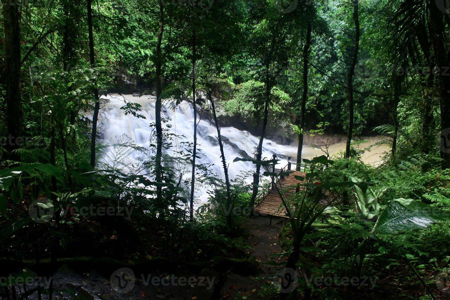 The beauty of a very natural waterfall scenery named Goa Rang Reng waterfall located in Gianyar Bali. photo