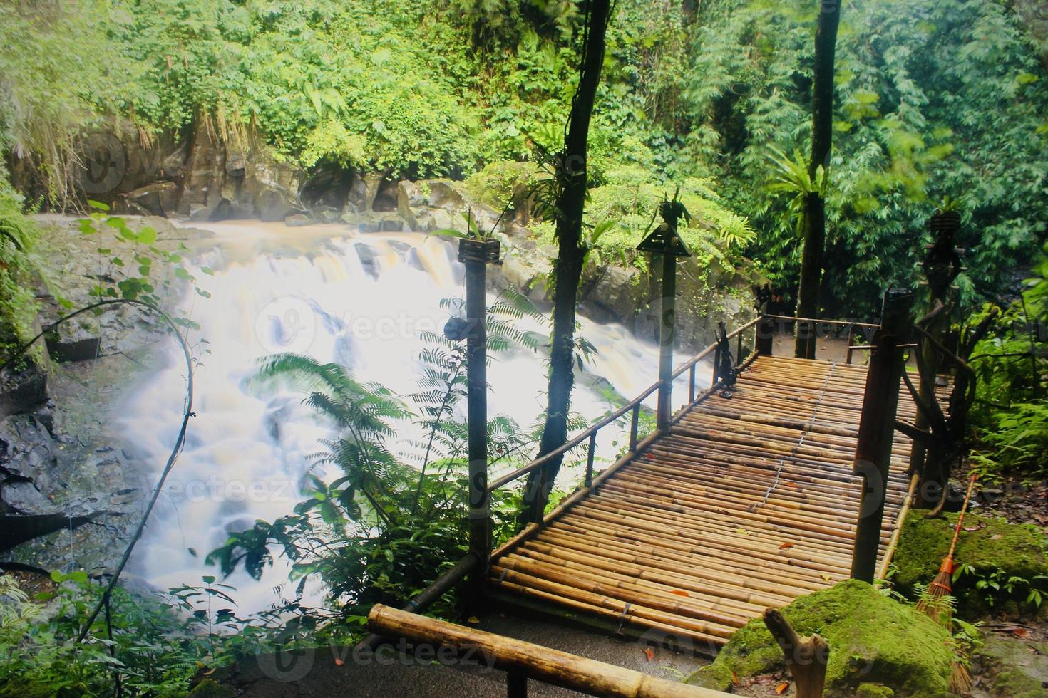 The beauty of a very natural waterfall scenery named Goa Rang Reng waterfall located in Gianyar Bali. photo