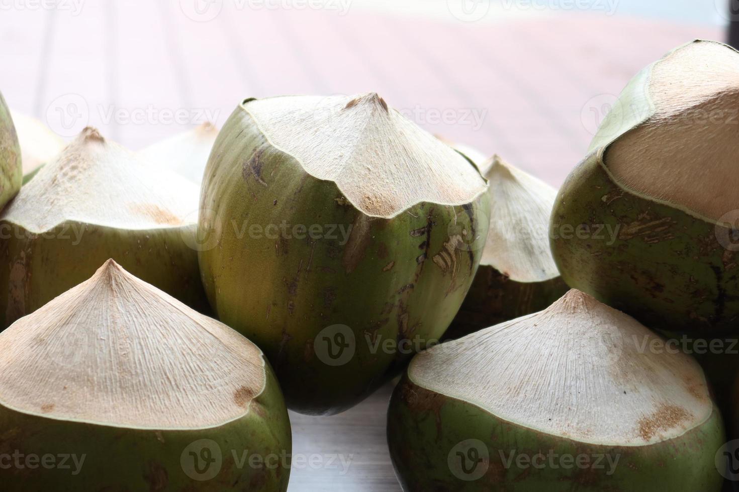 stack of fresh coconut display for sale photo