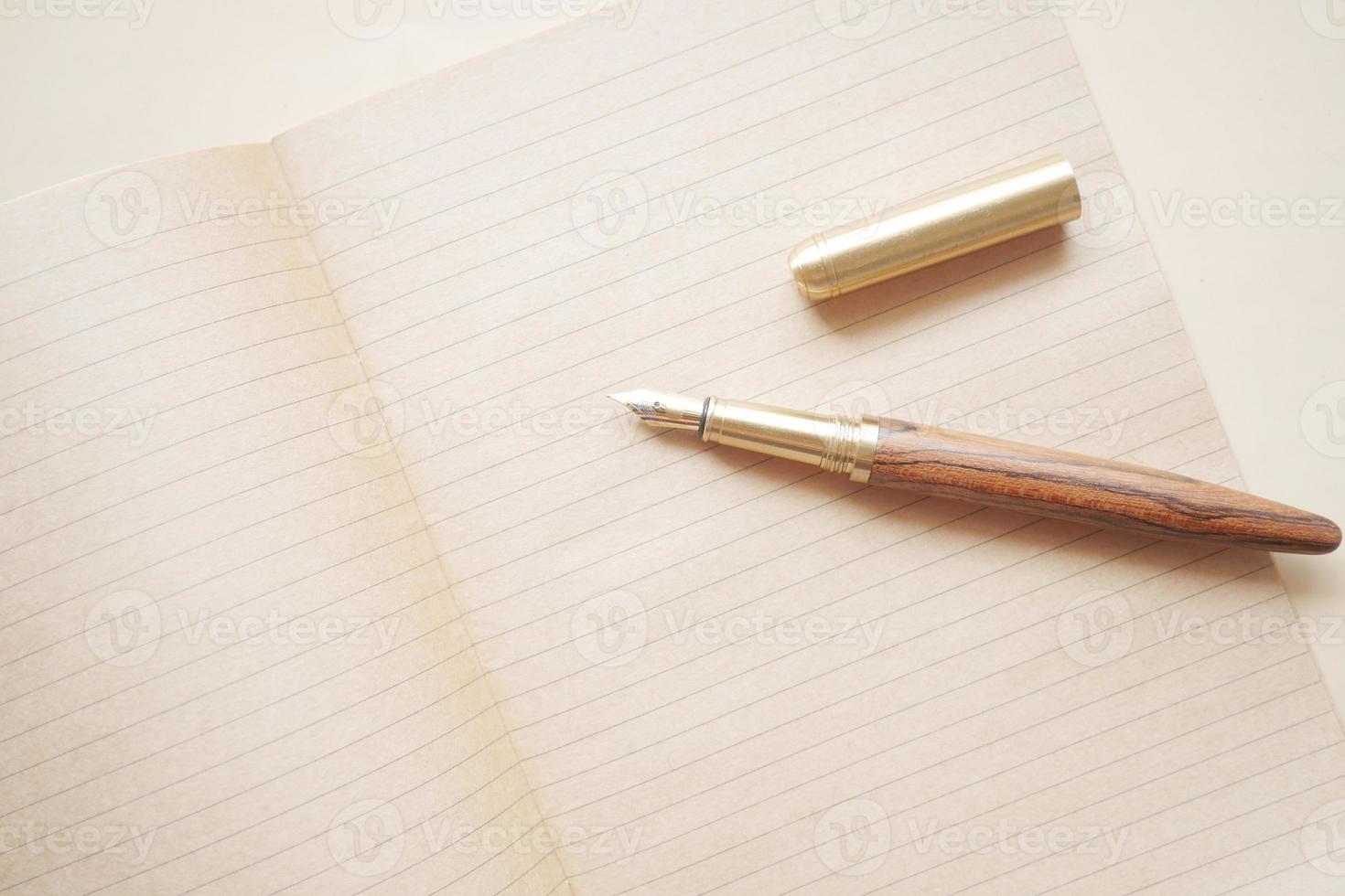 old empty paper and fountain pen on table photo