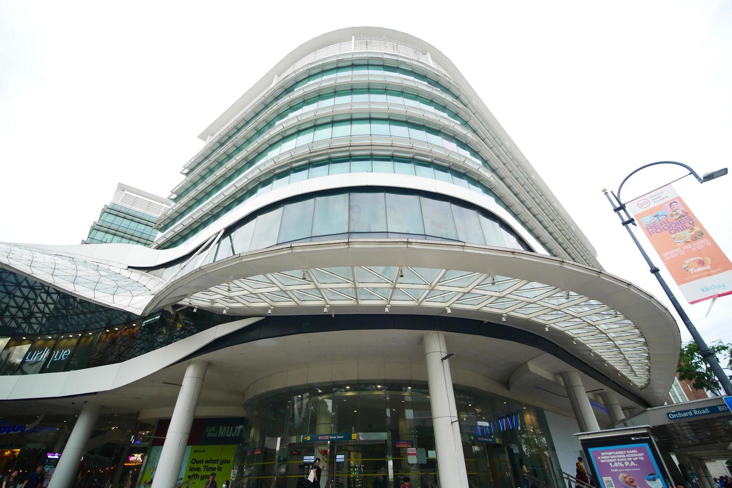 singapore 12 june 2022. plaza singapore shopping mall with people walking on road photo