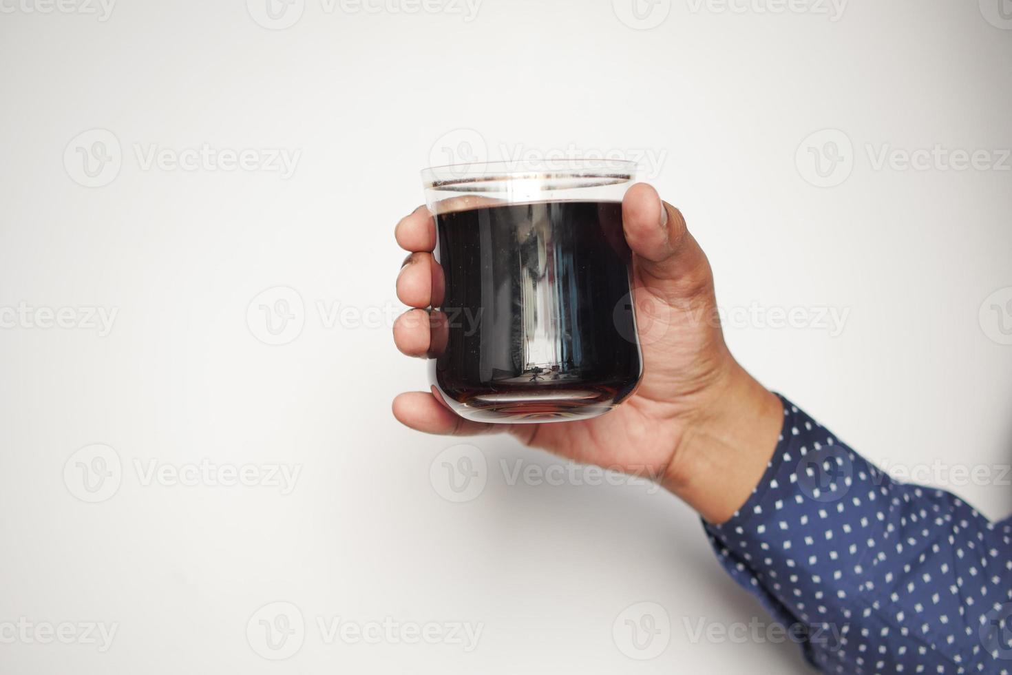 men holding a glass of soft drinks photo