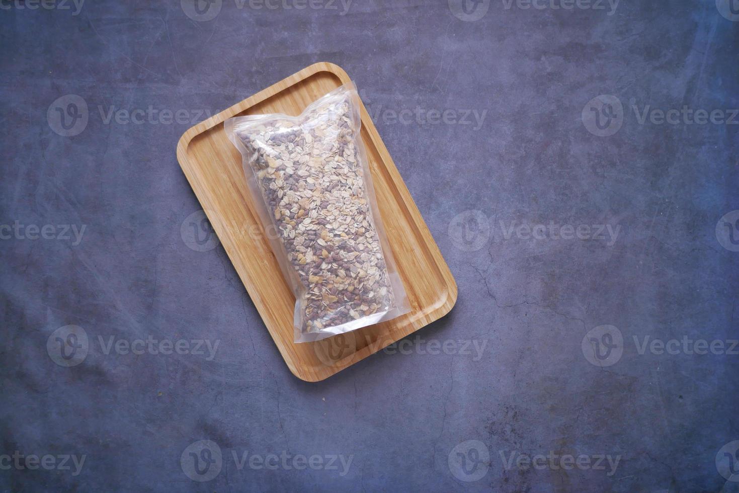 top view of granola Musli in a plastic packet on table photo