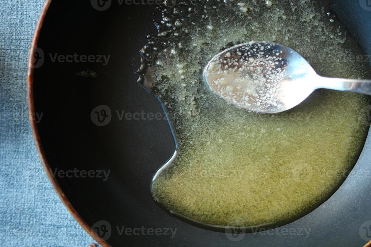 top view of homemade ghee on cooking pan on table photo