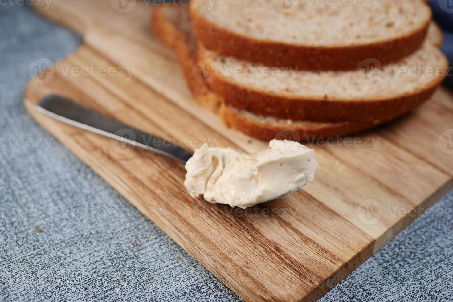 low fact cheese cream spread on a bread photo