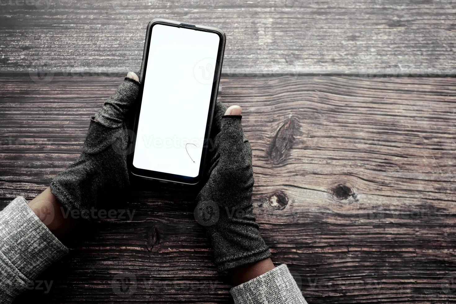 hacker hand stealing data from smart phone photo