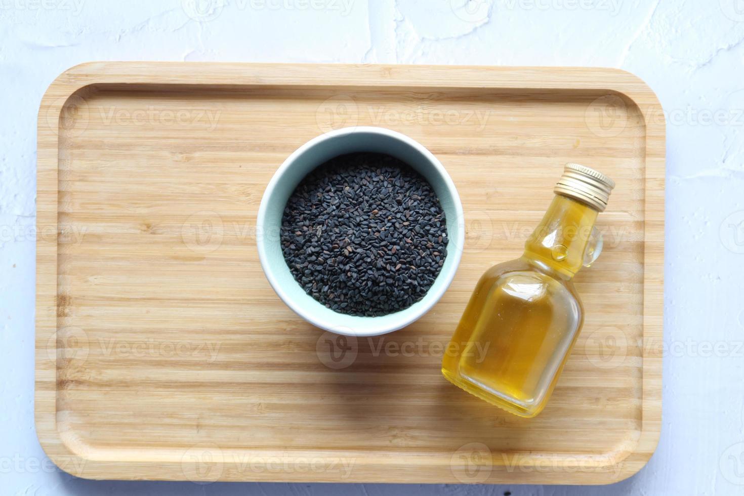 Black Cumin seeds oil on table top view photo